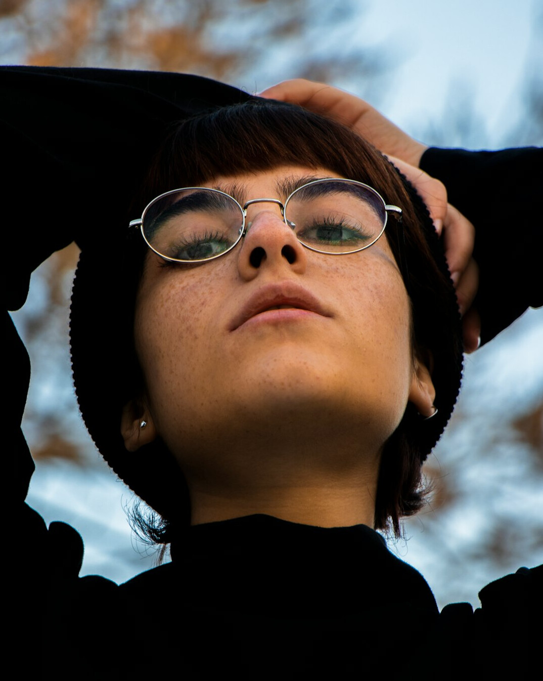 Portrait of a young European woman with glasses smiling