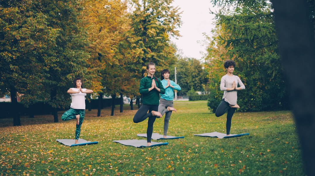 woman practicing yoga outdoors