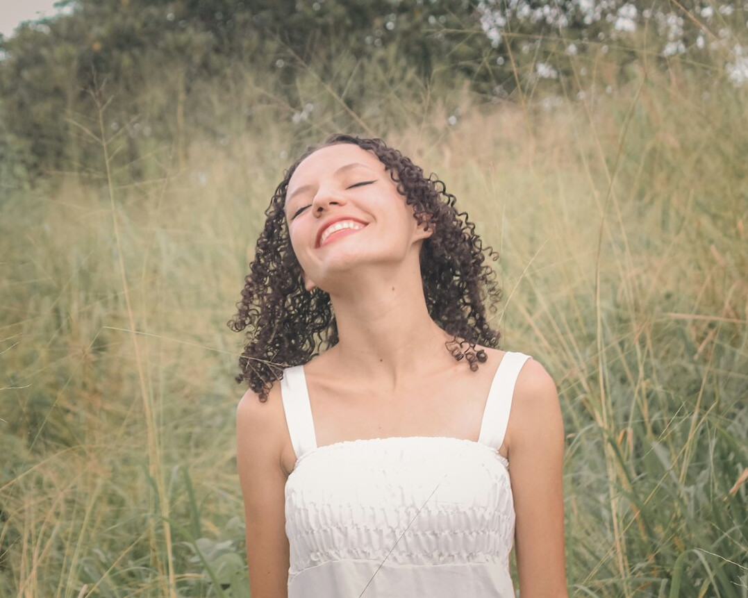 person breathing deeply outdoors