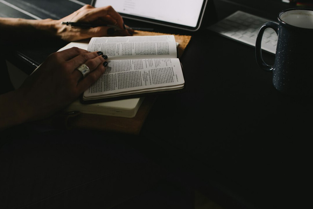person journaling at desk