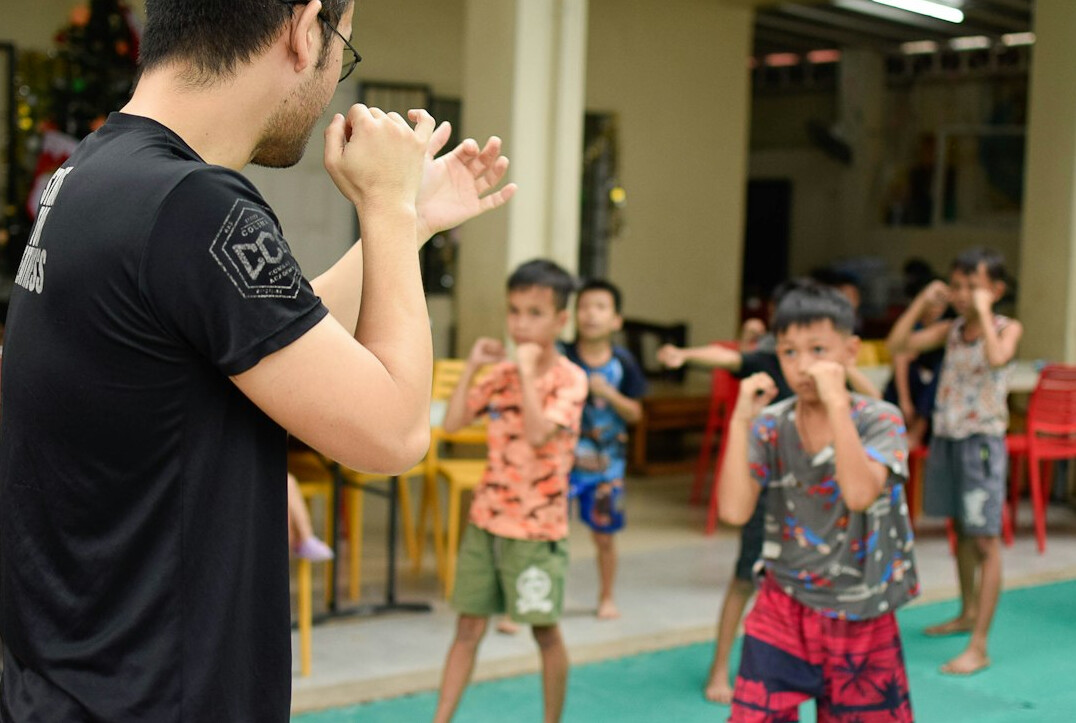 Health instructor explaining a topic to a small group of students